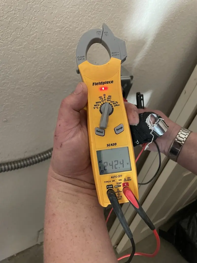 Voltage testing with clamp meter during Electrical Installation Services in Canandaigua
